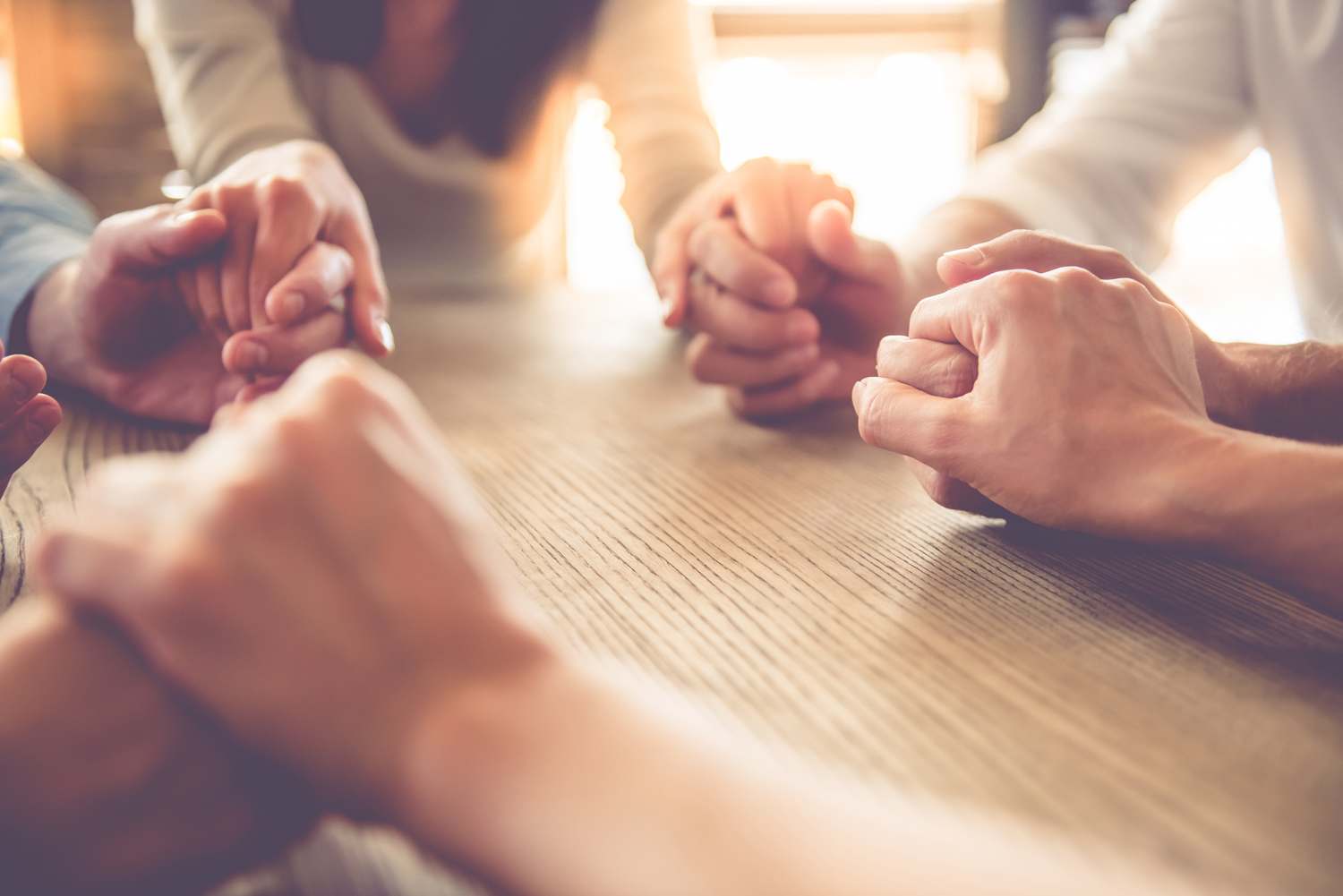 Why be Thankful image of people holding hands praying