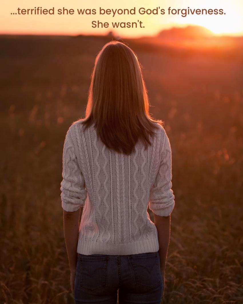 Women looking into sunset, feeling God's Forgiveness