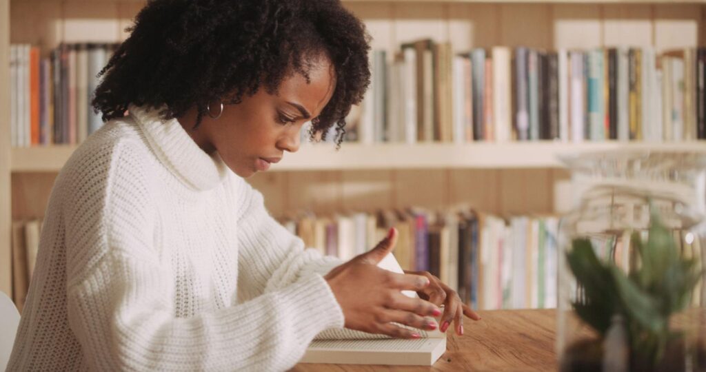 Woman learning from a book